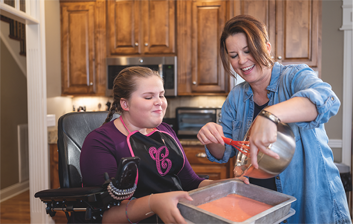 carlee, child with sma, baking with mom