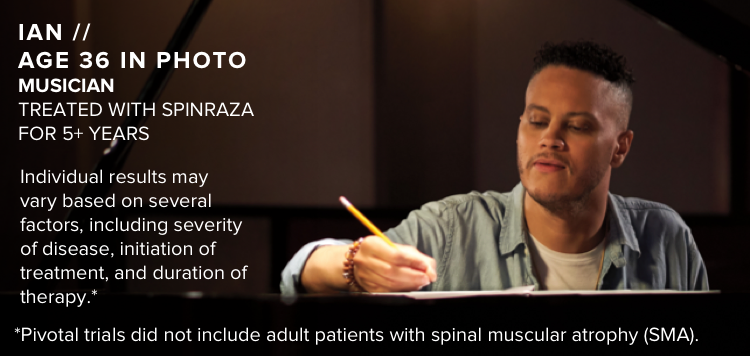 Ian, age 36 in photo, writing while sitting at a piano. Has SMA and has been treated with SPINRAZA for 5+ years.